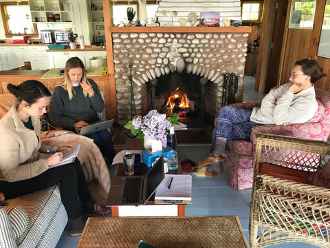 McNeill, Milicent and Carson working fireside in velvet slippers and furry babouches. 