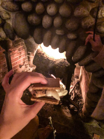 smores in front of stone covered fireplace.