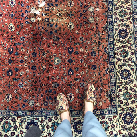 Oriental carpet shoes on Turkish rug.