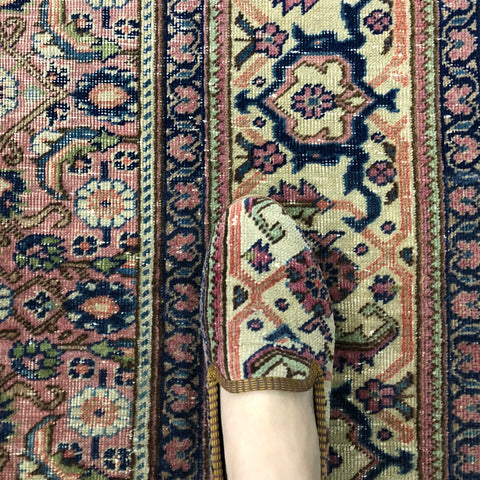 Oriental carpet shoes on rug