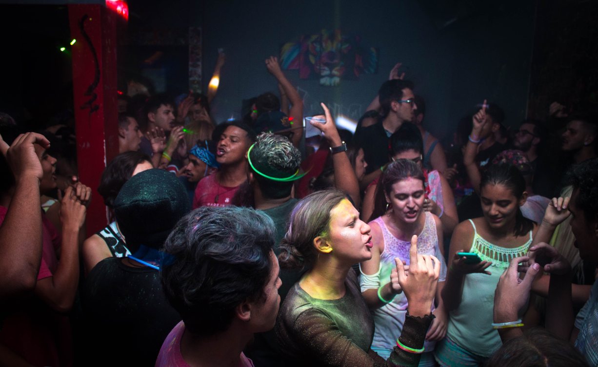 Excited crowd of people at a house party