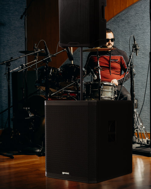 Gemini Sound speakers in front of a drummer