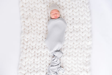 when to stop swaddling your baby