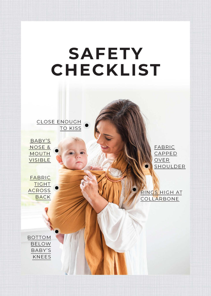 Woman wearing a baby in a brownish golden ring sling with notes on how to wear the ring sling