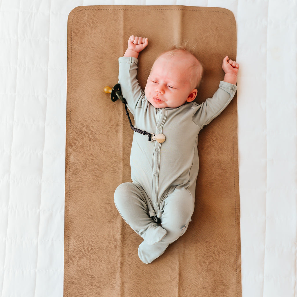 sleepy newborn, bamboo pajamas, gather mat, bibs pacifer