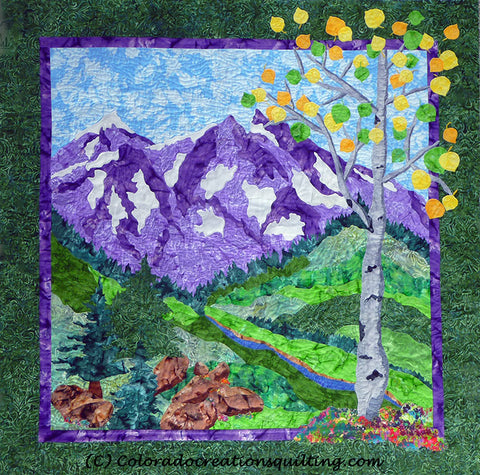 Pictorial landscape art quilt featuring purple snow-capped mountains with a blue stream, evergreens, boulders and aspen trees by Colorado Creations Quilting