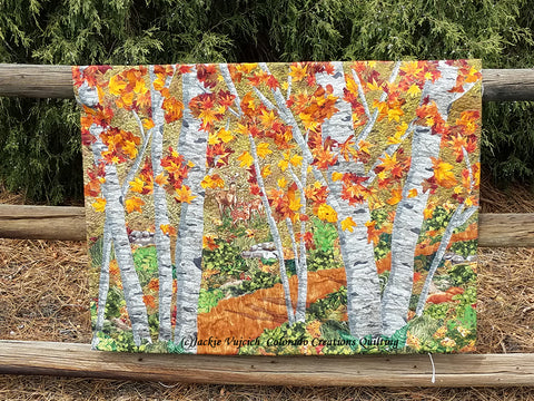 Art Quilt picturing a group of aspen trees in the woods by Colorado Creations Quilting