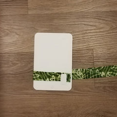 Green strip of fabric wrapped around a fabric organizing board.
