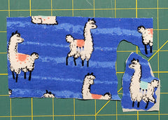 fabric llamas on a blue background