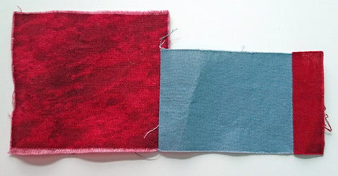 Scrap fabric pieces (squares and rectangles) are sewn together.