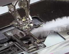 pipe-cleaner-cleaning-bobbin-area-of-sewing-machine