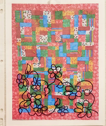 Quilt with a quilting design of flowers overlaid on top