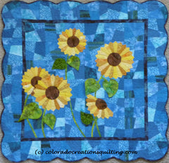 Yellow sunflowers made from wedge ruler on a blue background.