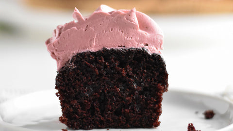 chocolate cupcake with pink American buttercream frosting