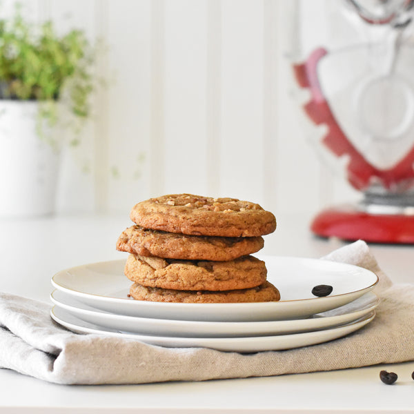 stack of cookies on plates with red SideSwipe beater in background