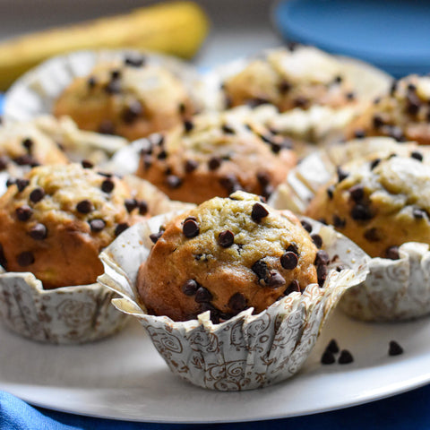 Banana chocolate chip muffins side view on plate