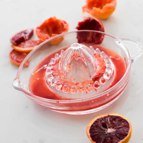 Blood orange juice on old fashioned glass juicer