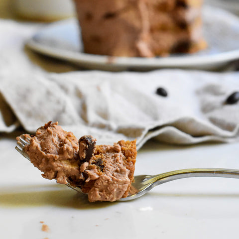 fork holding bite of mocha chip icebox cake