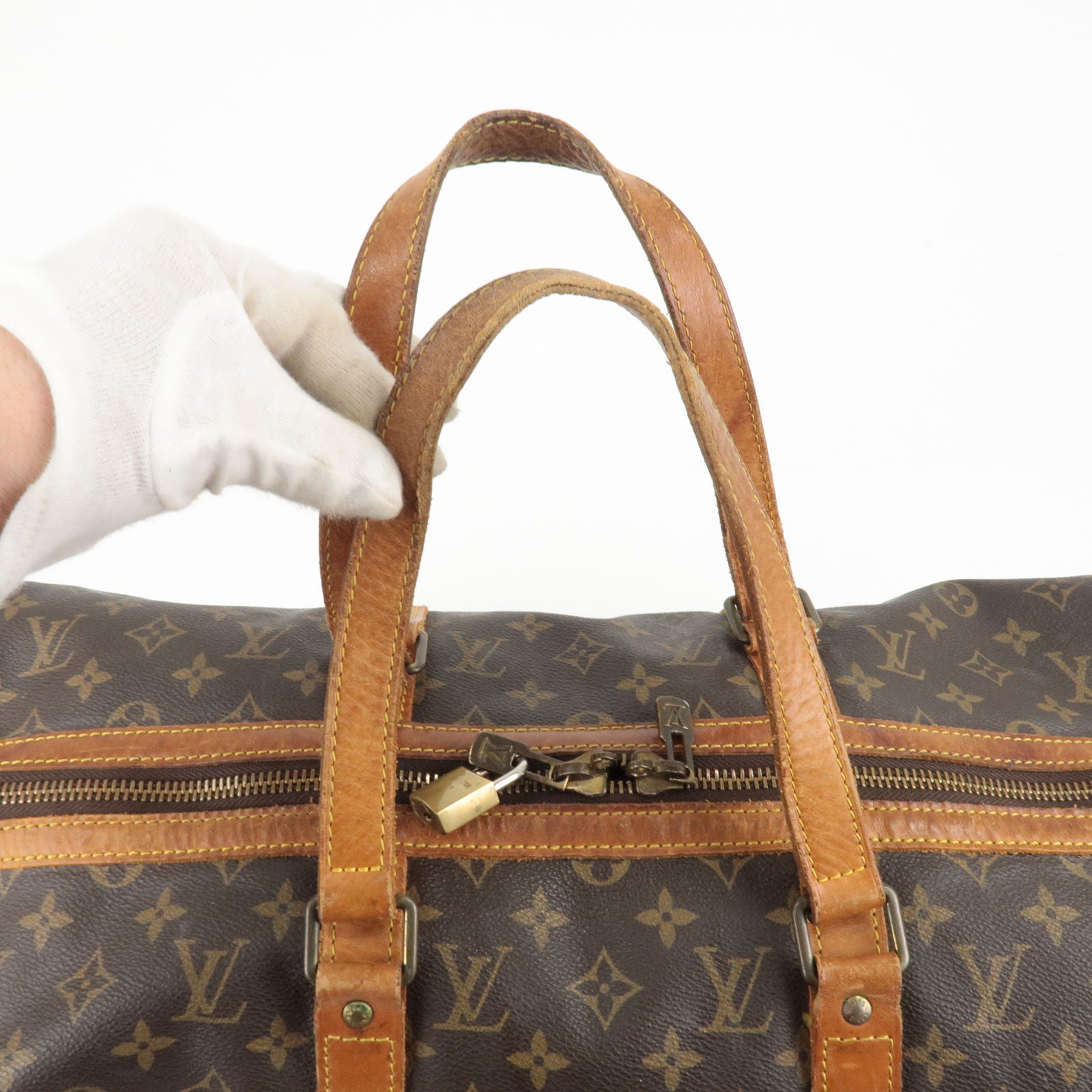 Sac à main Louis Vuitton Hudson en toile monogram marron et cuir