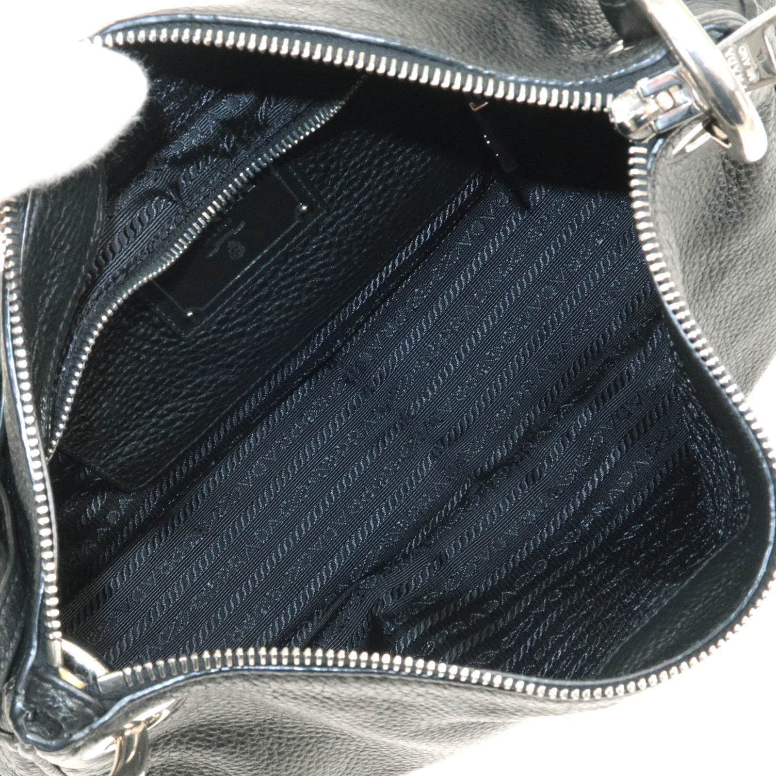 Prada Vitello Phenix Logo Embossed Hobo Bag - Black Shoulder Bags