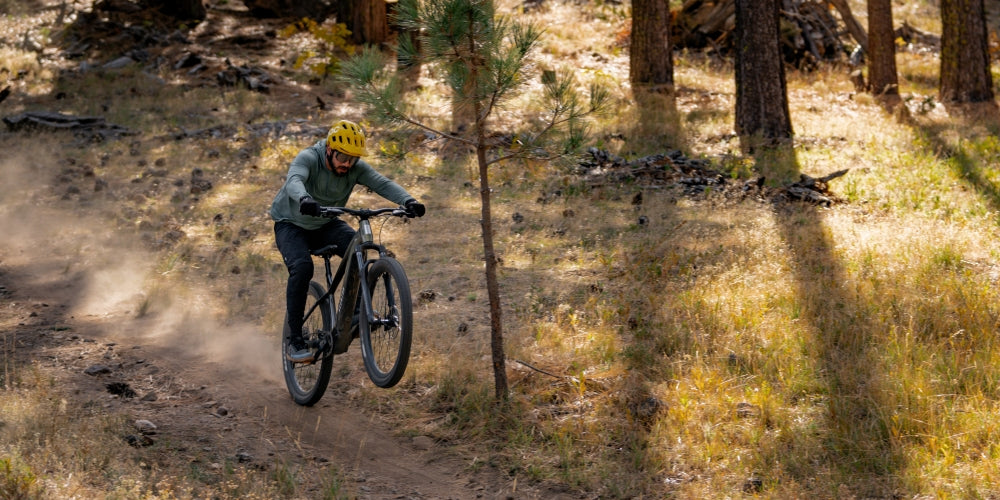 man-doing-wheelie-on-high-performance-aventon-ramblas-emtb-at-larose-forest