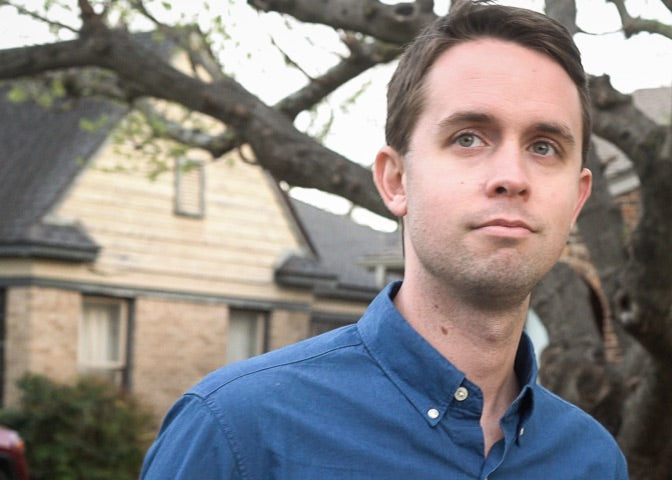 Man standing in front of a house.