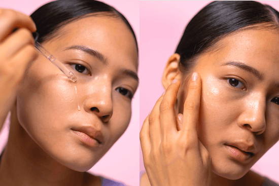 Young Korean woman applying clear serum to her her cheek.