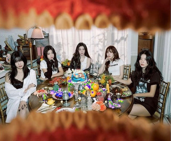 Red velvet members sitting around the dining table with cakes and other birthday food