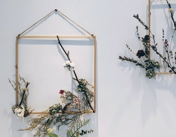 dried flowers in a hanging wood box frame
