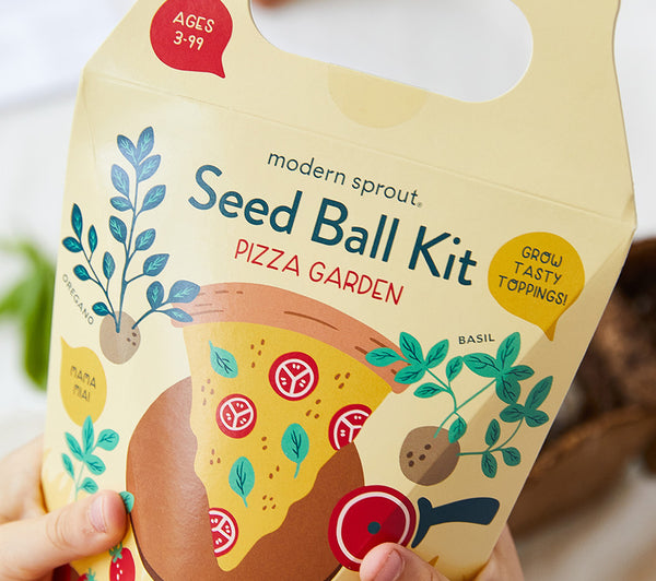 hands holding a Modern Sprout seed ball kit 