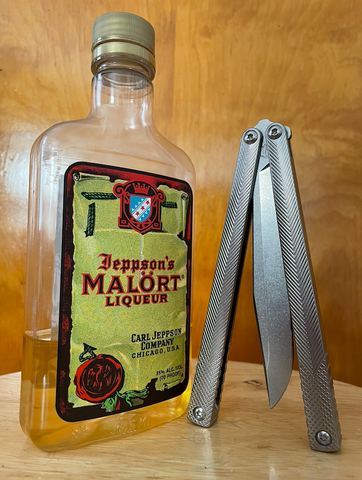 Machinewise Serif balisong and a bottle of Jeppson's Malört