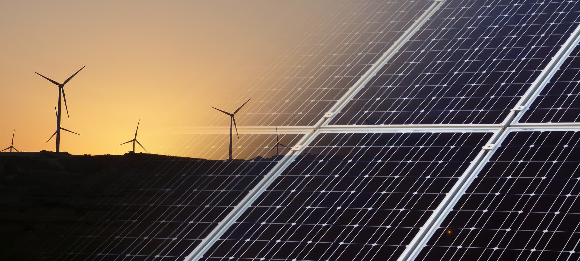 computer image of solar panel fading into a wind farm at sunset