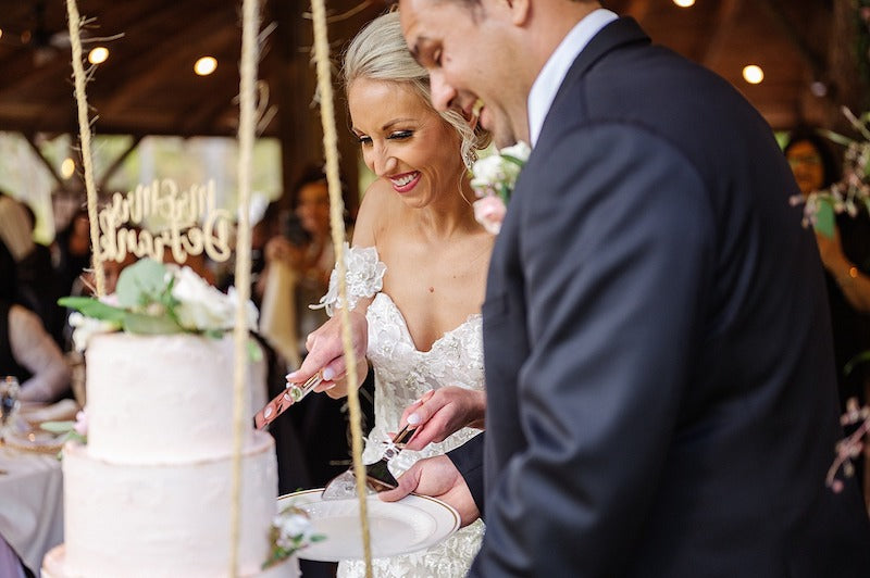 Bride and Groom Cutting Cake at Fernstone Retreat Wedding The Garter Girl