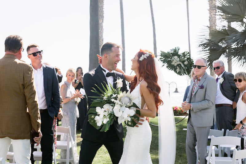 Bride and Groom Walking Down Aisle Tropical Boho Wedding The Garter Girl