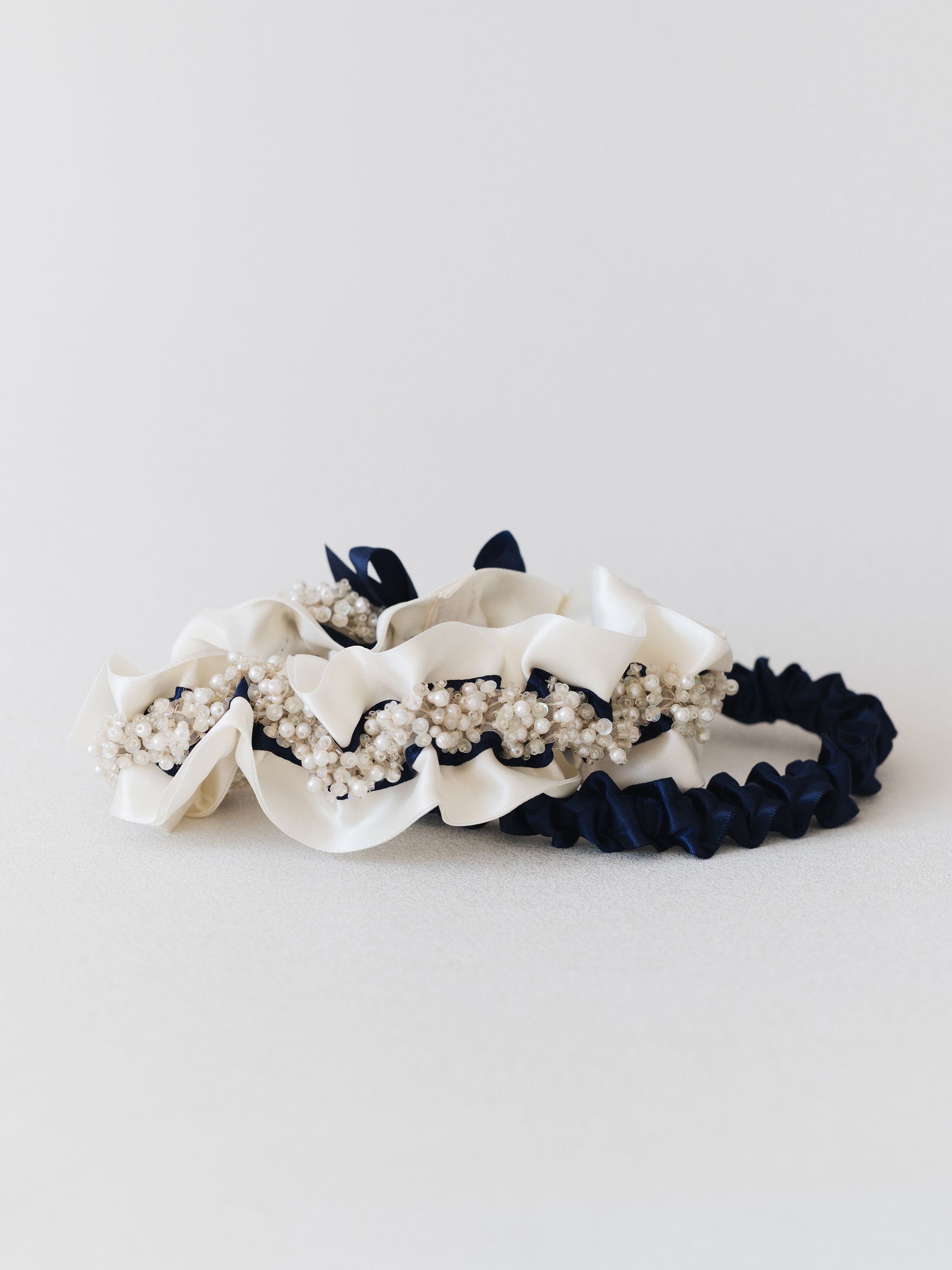 personalized wedding garter set with beads & ivory & navy blue satin by expert bridal accessory designer, The Garter Girl