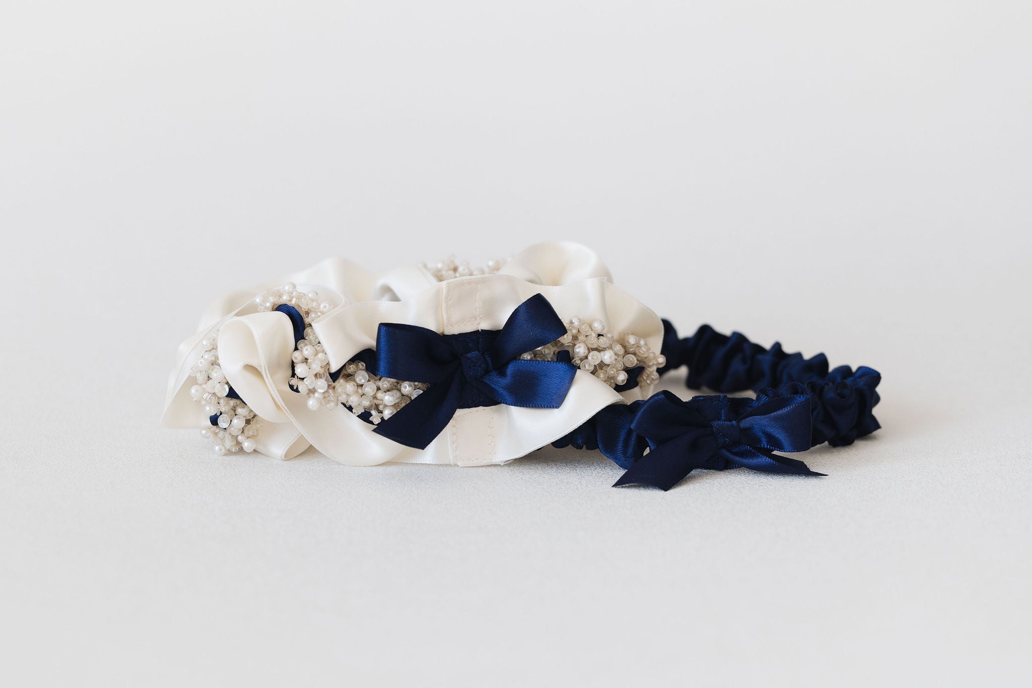 personalized wedding garter set with beads & ivory & navy blue satin by expert bridal accessory designer, The Garter Girl