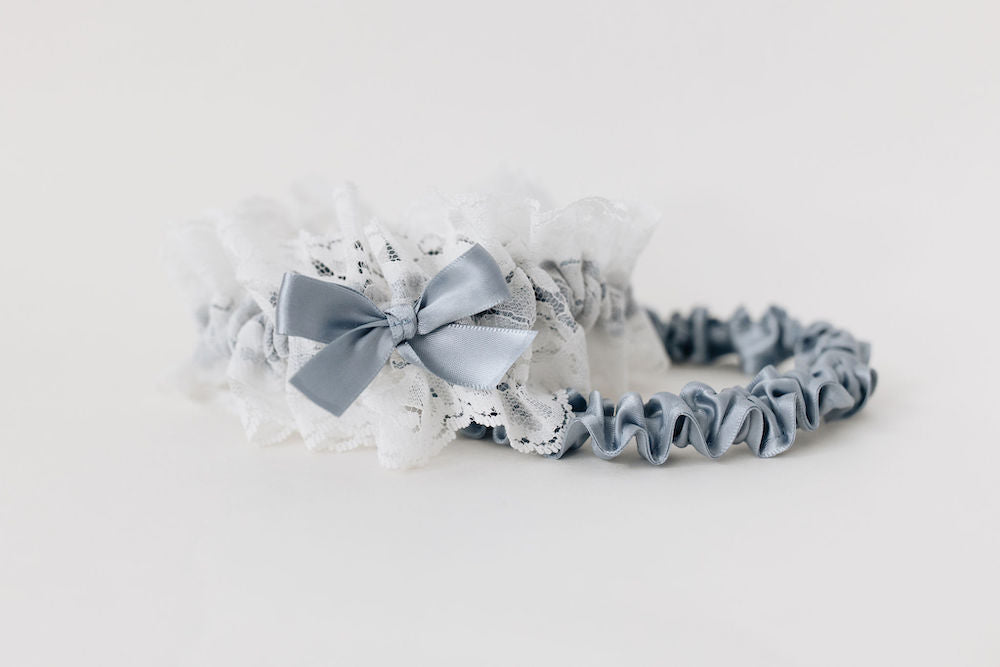 wedding garter set with main ivory lace garter and blue satin tossing garter with custom embroidery handmade by The Garter Girl