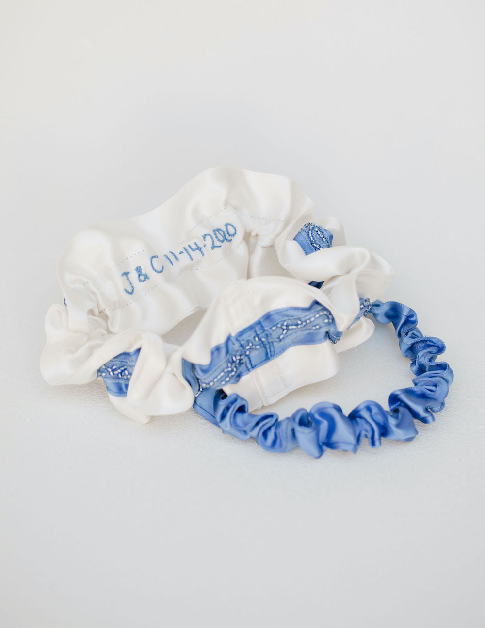 something blue beaded wedding garter set with personalized hand embroidery heirloom by The Garter Girl