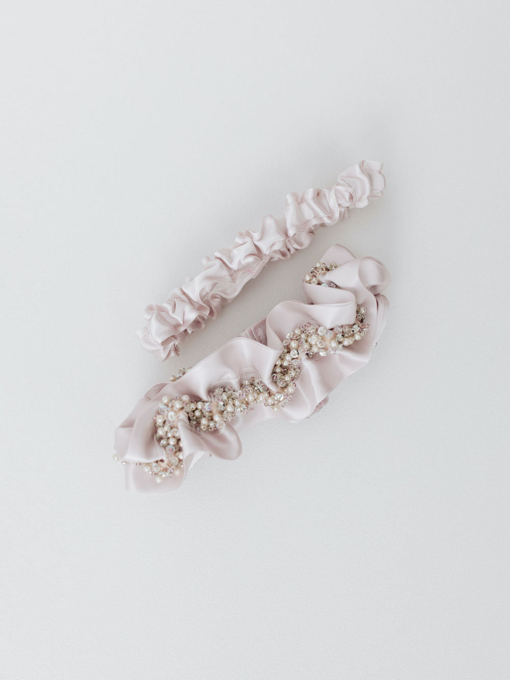 blush satin & sparkle beaded wedding garter set personalized with hand embroidery by expert bridal accessories designer, The Garter Girl