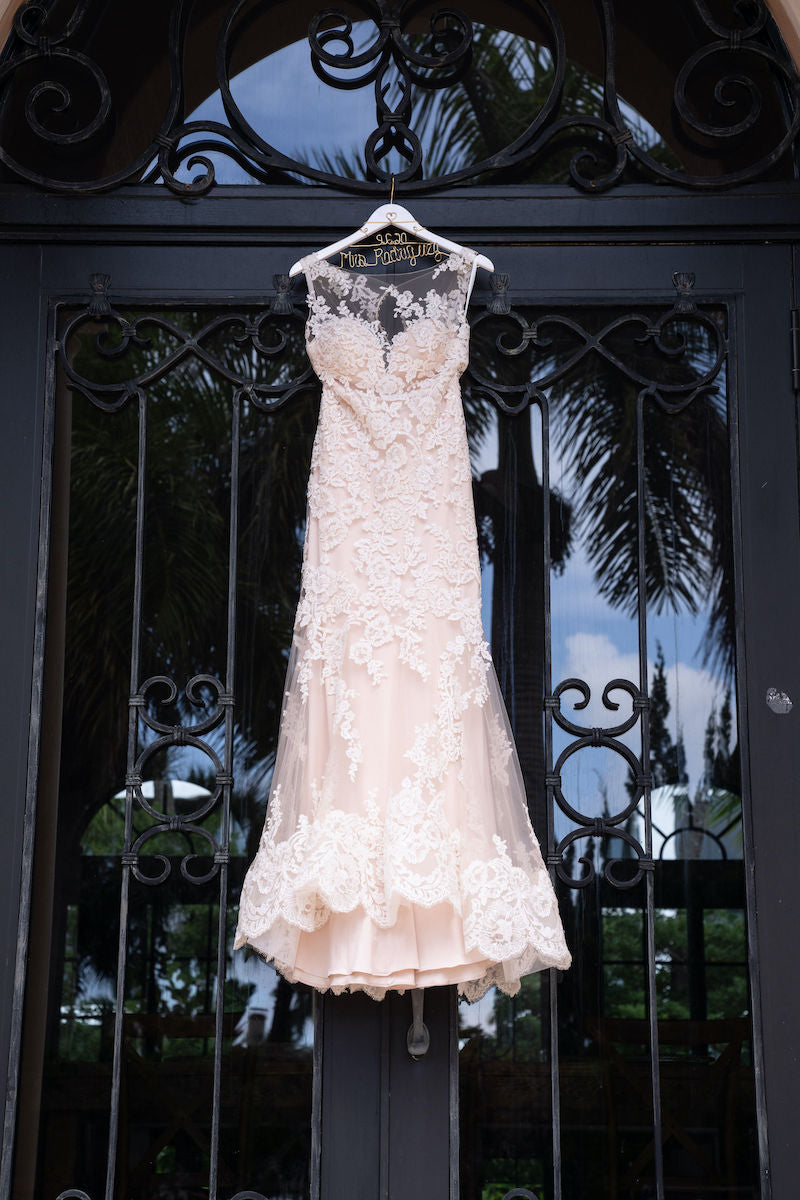 Bridal Gown Hanging At Home Wedding