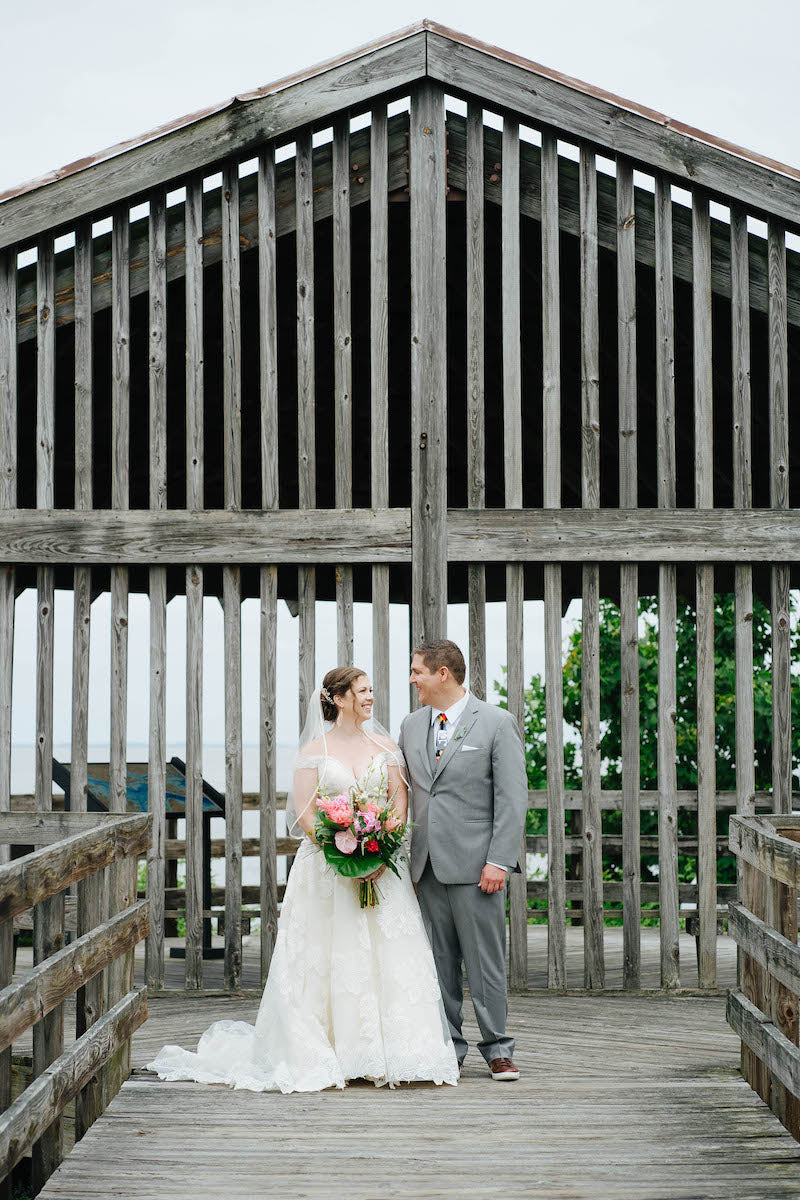 Bride and Groom on Waterfront Pier