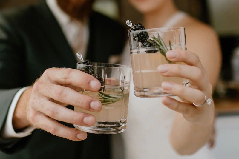 Bride and Groom Cheers Drinks Engagement Ring