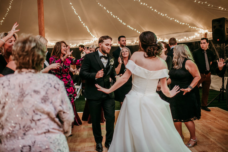 Bride and Groom Dancing With Guests