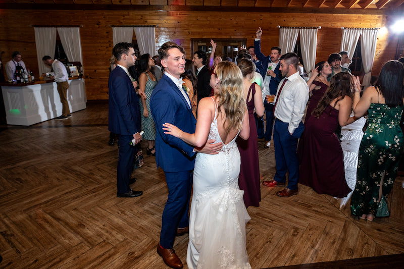 Bride and Groom Dancing With Guests