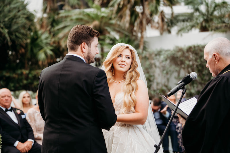 Bride and Groom Exchange Vows at Elegant Tropical Wedding