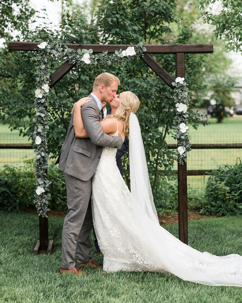 Bride and Groom First Kiss Outdoor Wedding Ceremony