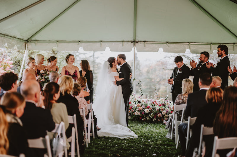 Bride and Groom Married at Tented Ceremony