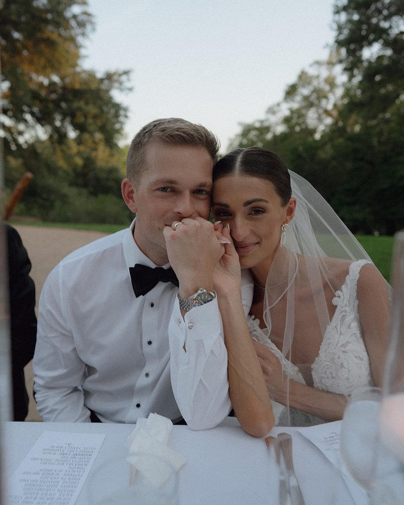 Bride and Groom at Wedding Reception Table