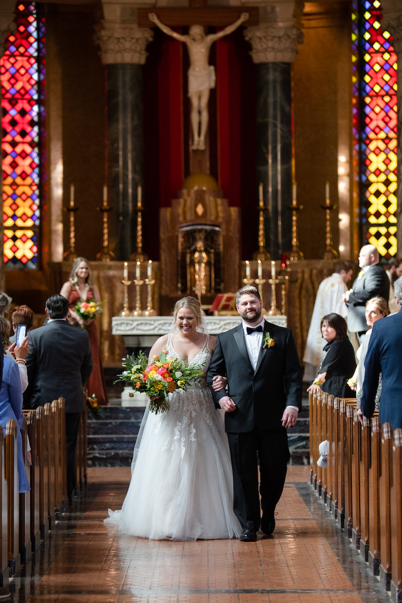 Bride and Groom Walk Down the Aisle As Newlyweds