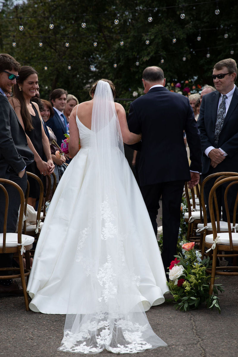 Bride and Father Walk Down Wedding Aisle